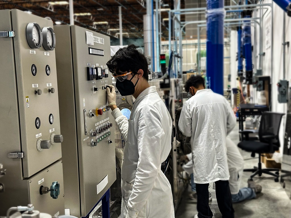 Employees working on factory floor